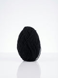Studio shot of a 50g skein of black milk cotton yarn, showcasing its soft texture and matte finish.