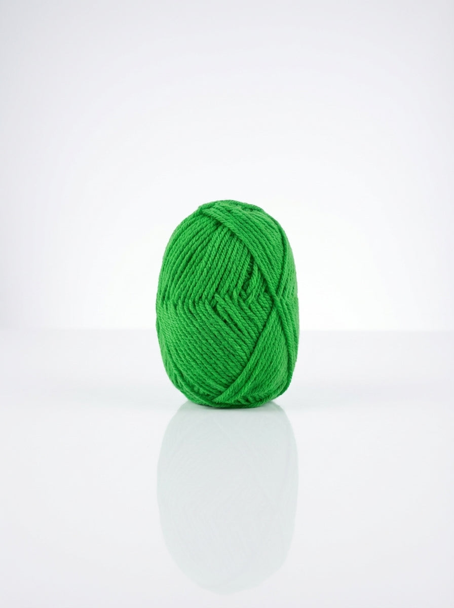 Ball of apple green cotton yarn, showing its soft texture and vibrant color. Ideal for knitting and crochet.