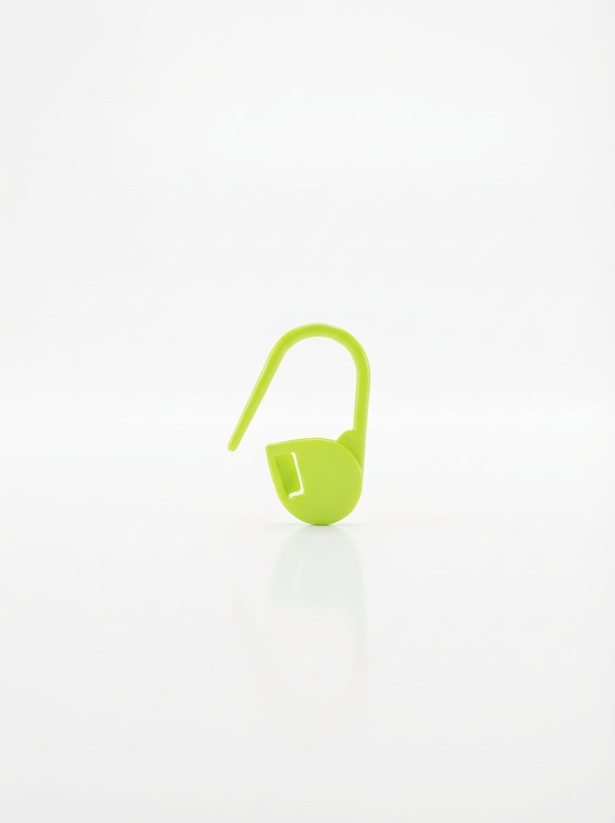 Apple green plastic crochet latch clip hook, close-up studio shot showing texture and color.