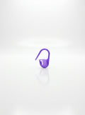 Studio shot of a purple plastic crochet latch hook tool for rug making and other yarn crafts.